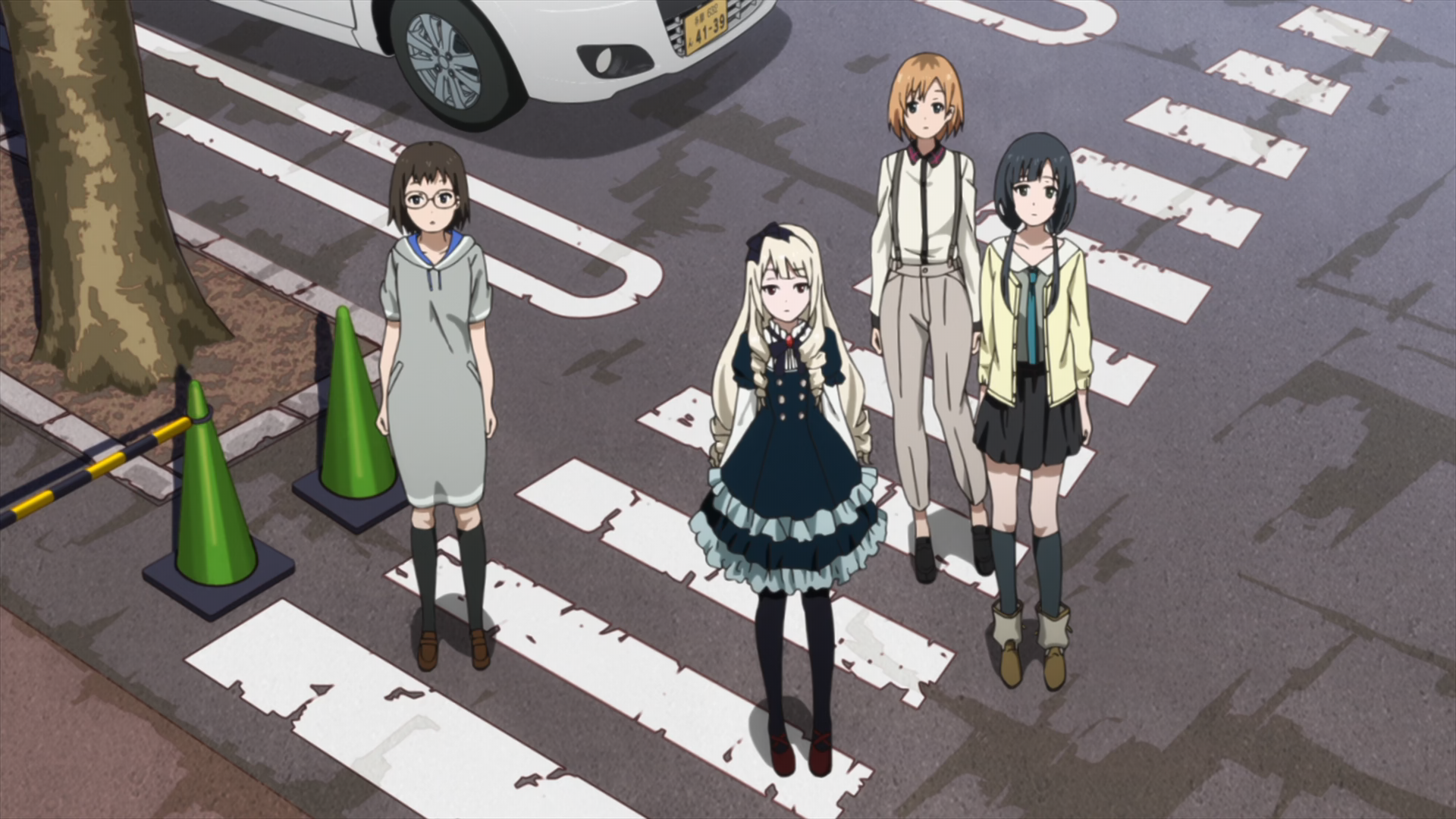 Scene from Shirobako with Aoi hanging out with the animators. Aoi is wearing a casual-looking white suit with suspenders